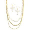 Coquette gold necklace