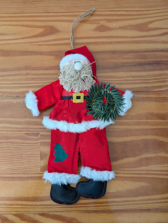 Plush Santa with Wreath from Unknown -  Holiday Decor (Fabric, Faux Fur, Plastic, String Ornament, Handmade, Craft, Traditional, Red, White, Green)
