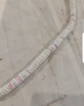 Vintage Puka shell necklace brings the island vibes! Features white and pink shells on a 17" strand