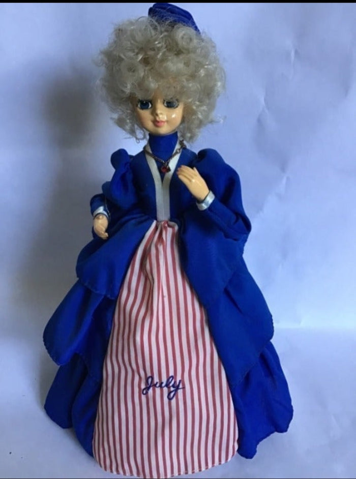 Collectible 1986 Brinn's Musical July Calendar Doll.