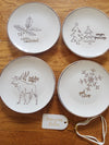 Four American Atelier holiday-themed dessert plates. Christmas