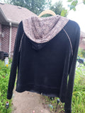 Classic black with a fun, eye-catching leopard print hood and pocket trim.