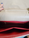 Quilted Leather beige purse with gold tone accents and chain.