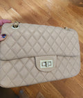 Quilted Leather beige purse with gold tone accents and chain.