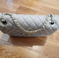 Quilted Leather beige purse with gold tone accents and chain.