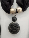 <span;>Black scarf with silver tone beads and black lava bead in middle of scarf.